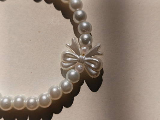 Pearl bow charm bracelet